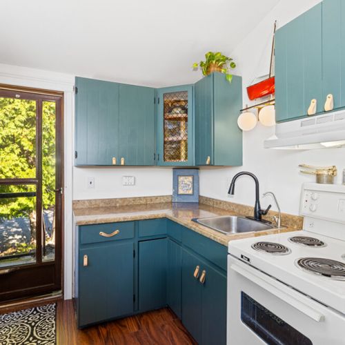 The fully equipped kitchen makes preparing meals easy, with everything you need just steps from the deck.