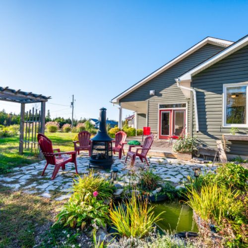 Enjoy tranquil garden views and a cozy firepit beside a peaceful pond. A scenic spot for evening drinks, stargazing, and connecting with nature.