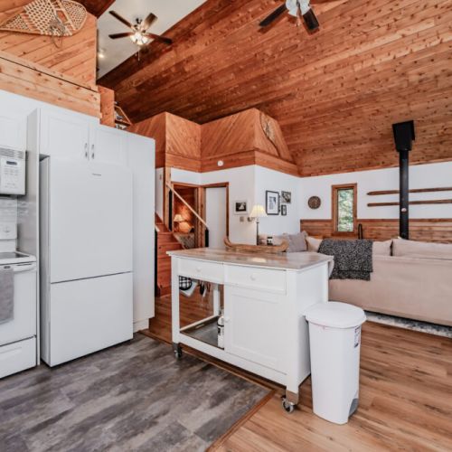 Fully equipped kitchen with modern appliances, open shelving, and island space — everything you need for a relaxing vacation cooking experience.