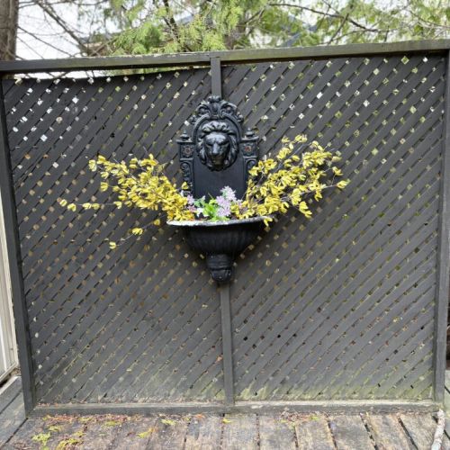 Decorative Water Feature: Tucked away on the patio is a decorative water feature that brings a sense of calm to The Louise’s outdoor space. The classic design and the gentle sound of water create a tranquil atmosphere for guests to enjoy while they relax and take in the beauty of the surroundings.
