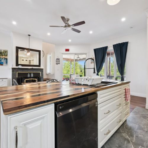 Gather around the large kitchen island while enjoying views of the dining and living areas.
