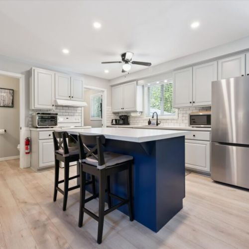 Fully equipped modern kitchen featuring a large island and everything needed for family meals and entertaining.
