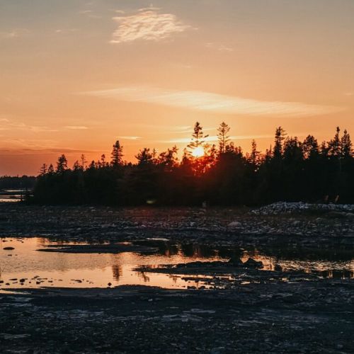 End each day with unforgettable west-facing sunsets as the sky turns gold and pink over crystal-clear water.