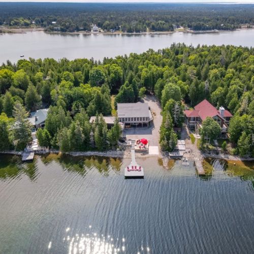 Welcome to Eagle Bay, an astoundingly private and gorgeous cottage in the prestigious Howard Bowman no public access community.