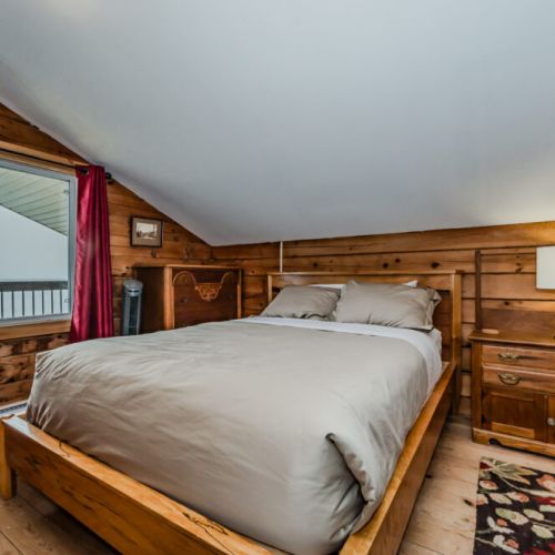 Drift off to sleep with the soothing sounds of the lake in the cozy master bedroom.