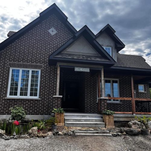 Front entrance of The Brick House, offering a warm and welcoming arrival
