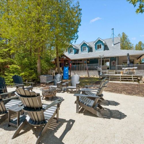 Gather around the outdoor fire pit and enjoy spacious waterfront living with room for the whole group.