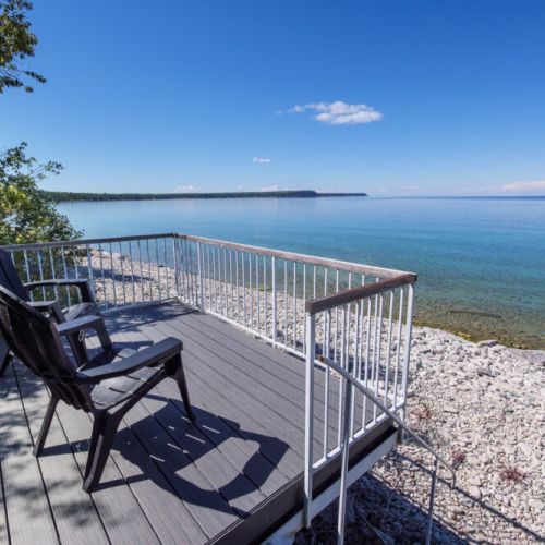 Comfortable Adirondack chairs offer the perfect front-row seat to unforgettable lake views.