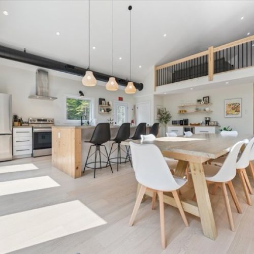 A farmhouse-style table with plenty of seating brings everyone together for shared meals and lasting memories.