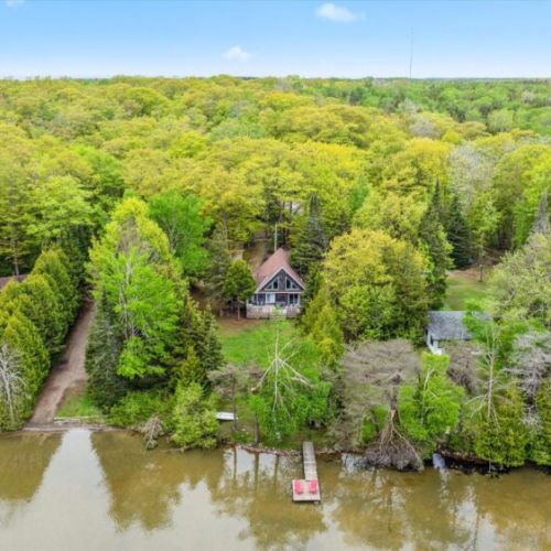 Framed by tall evergreens and hardwoods, Lakeview Loft is your woodland getaway with all the charm of traditional cottage life.