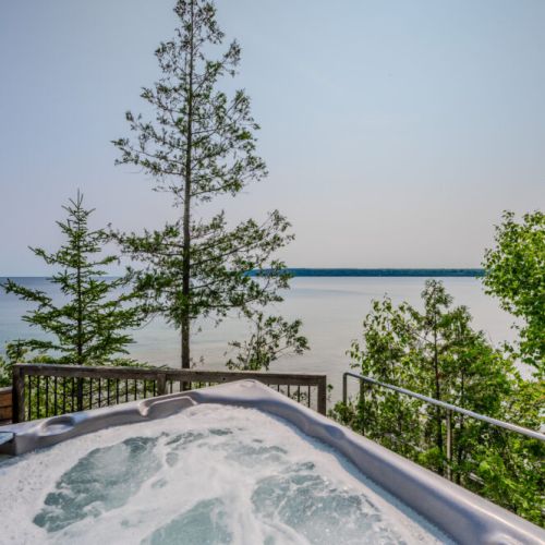 Enjoy a relaxing soak in the hot tub, this is the ultimate spot for unwinding and appreciating the serene natural beauty.