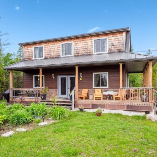 Enjoy the full wraparound porch, a large green space, and scenic privacy. This is where your outdoor mornings with coffee or peaceful evenings under the stars begin.