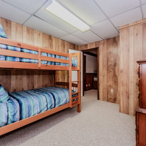 Cozy bunk bed room perfect for family getaways at the cottage! Enjoy a peaceful vacation surrounded by nature.