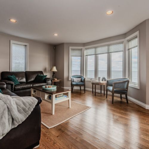 Sit back and relax in this cozy bay window nook, offering stunning, unobstructed views of the Georgian Bay waterfront. A tranquil spot to soak in the natural beauty of the Bruce Peninsula and watch the sunsets.