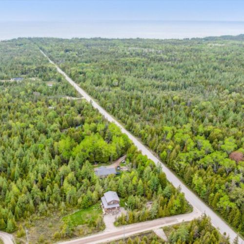 With minimal neighboring structures and uninterrupted green space, the quiet rural roads winding through this woodland landscape make Sunny Meadow Place feel like your own personal sanctuary.