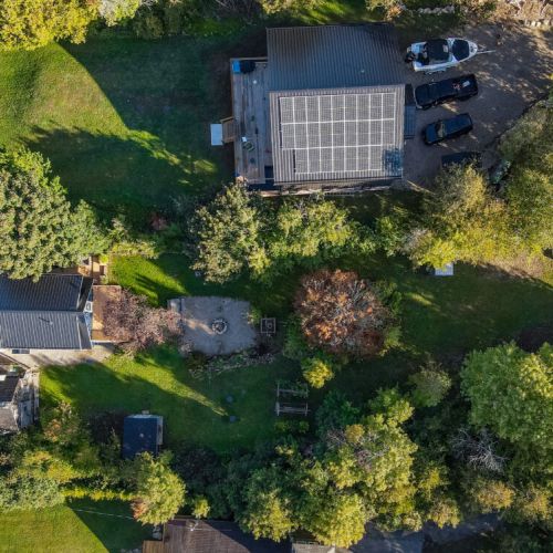 Get a bird’s-eye view of the stunning property, showcasing the extensive grounds and beautiful surroundings.