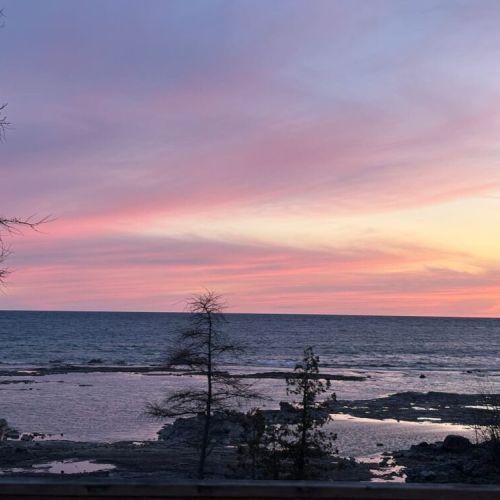 Enjoy peaceful evenings on the waterfront with pastel skies stretching endlessly over crystal-clear waters.