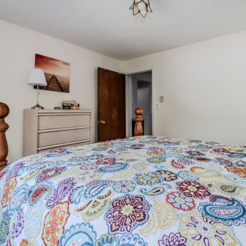 A different perspective of the second bedroom, showcasing its relaxing ambiance and ample natural light.