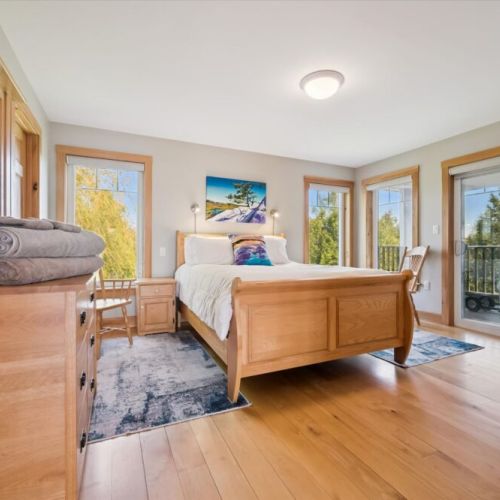 Bedroom 2: Spacious bedroom retreat with large windows and peaceful natural light.