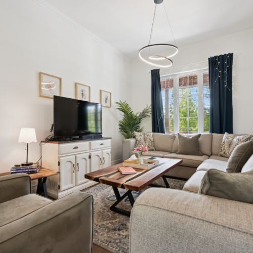 Bright and spacious living room with plenty of seating for relaxing or gathering with family and friends