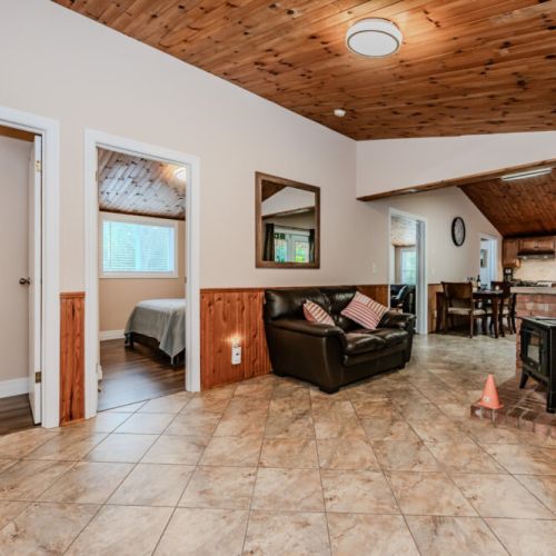Cozy up next to the charming brick fireplace, offering warmth and comfort for those cooler nights.