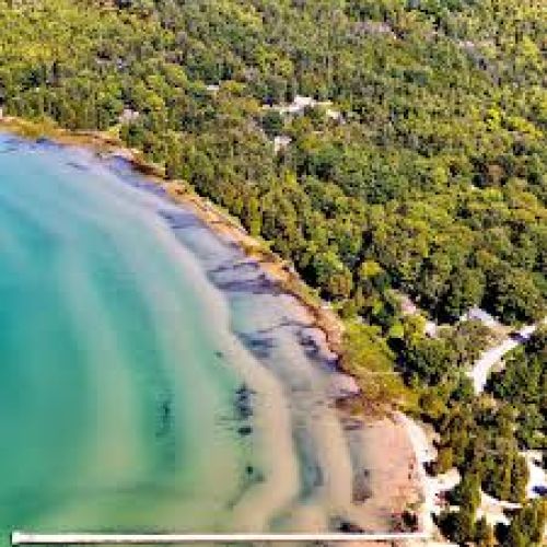 Enjoy the gorgeous private sands of Red Bay Beach nearby.