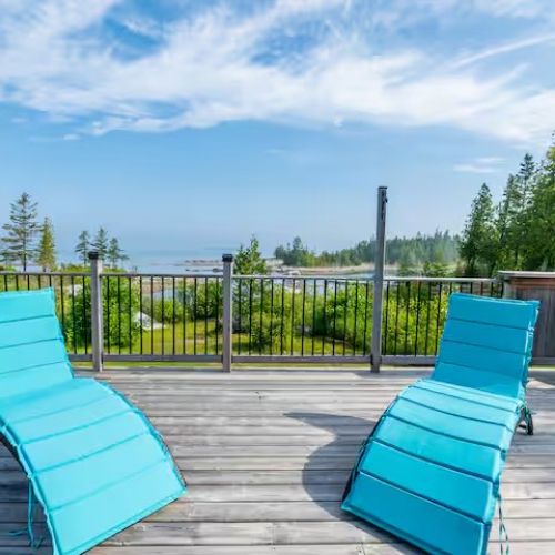 Enjoy the sunshine on the spacious deck with comfortable loungers, the perfect spot for your morning coffee or sunset drinks.