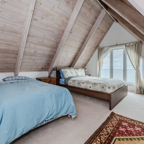 Enjoy a unique perspective of the bay from the loft’s large windows, perfect for waking up to the sunrise over the water.