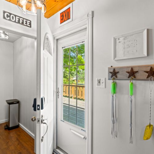 A welcoming entryway with easy access to the spacious wraparound deck.