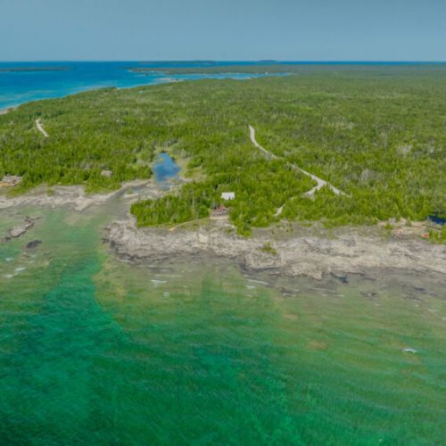 The clear waters of the shoreline provide a pristine and serene backdrop for your vacation. The rocky shoreline and vibrant waters are perfect for exploring, kayaking, or simply enjoying the natural beauty.