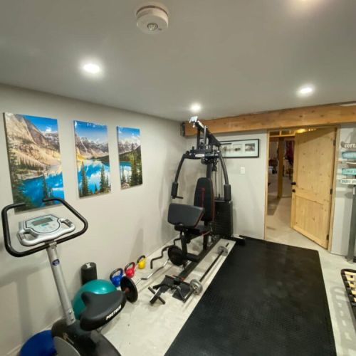 Step from the workout room into the games room featuring ping pong, a dart board, acoustic guitar, and electric piano for relaxing or having fun. Best of all, enjoy direct basement access to the hot tub.