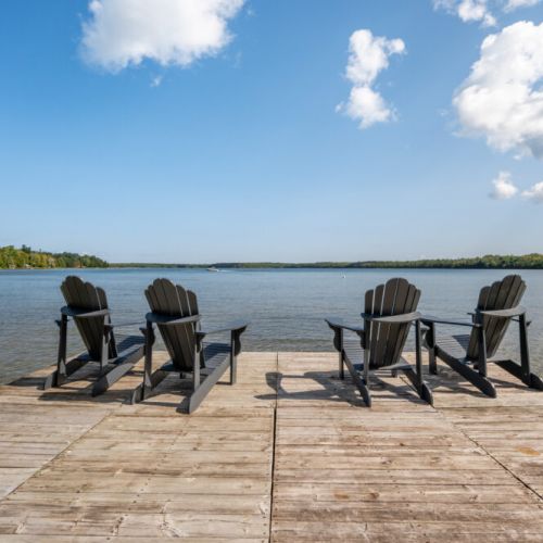 Take a dip and dry off in the Adirondack chairs on the dock.