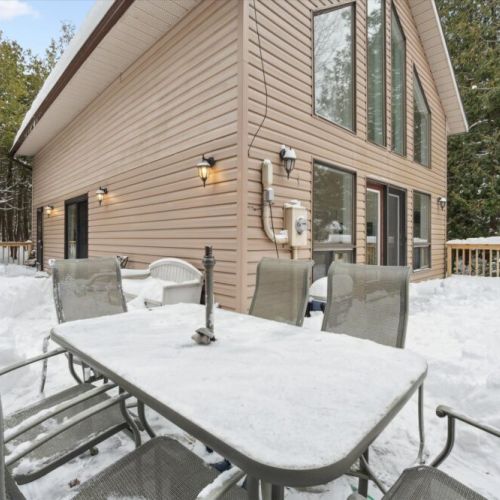 Spacious deck with outdoor dining set—perfect for meals, coffee, or evening drinks