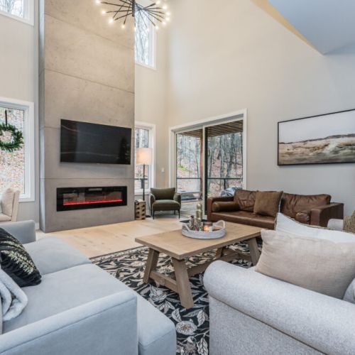 Featuring a toasty fireplace and smart TV with modern decor, perfect for entertaining guests and family on those special occasions or summer vacations.