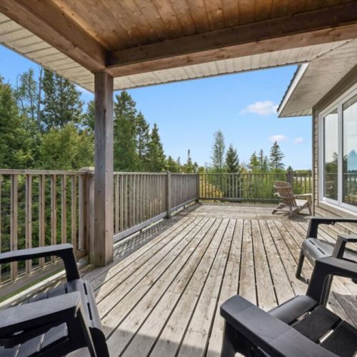 Large upper deck perfect for outdoor lounging and enjoying peaceful views.