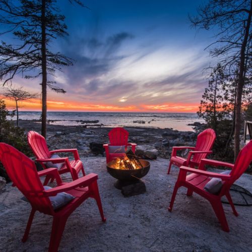 Cozy up at the bonfire pit and watch the sunset.