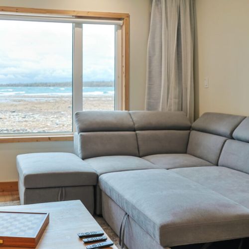 Unwind in the cozy recreation room and enjoy breathtaking lake views. This space is perfect for relaxing with friends and family, playing games, or watching movies.