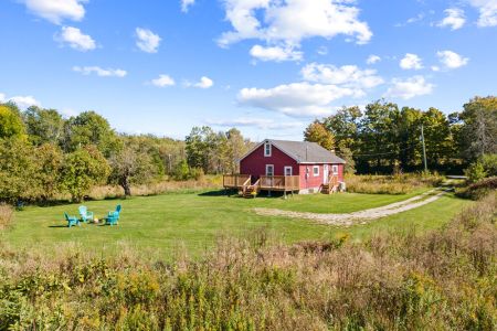Smith Homestead offers a private rural setting with a spacious lawn, new deck and plenty of room to relax outdoors.