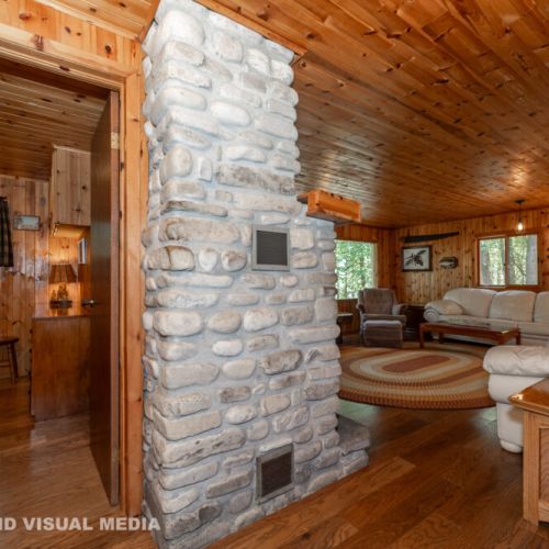 End your day by the wood stove while enjoying a warm, inviting space filled with rustic charm.