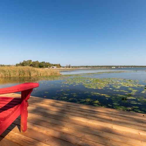 Morning coffee spot on the dock with calm Stokes Bay waters stretching out ahead.