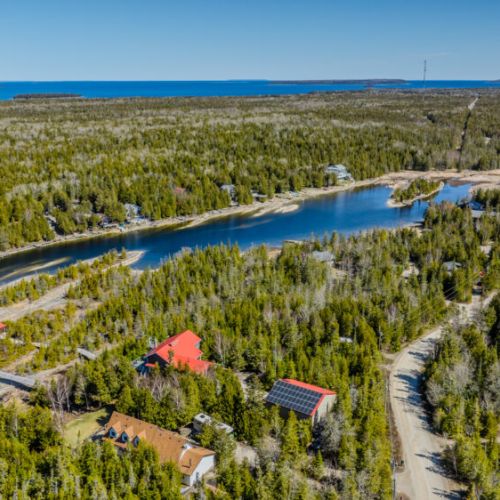 Private waterfront retreat nestled in a wooded peninsula with calm canals—ideal for boating, fishing, and immersive nature escapes.