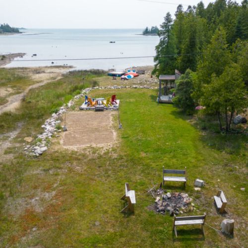 Enjoy a sunset by the firepit, or take a dip with water access directly off the back of the property.