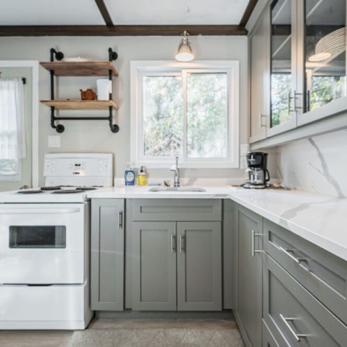 The kitchen is roomy and stocked with plenty of cookware and utensils for your use.