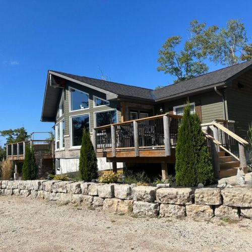 The spacious front deck offers beautiful views and plenty of room to enjoy fresh air and quiet moments outdoors.