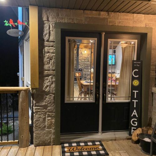 The welcoming front entrance invites you into a warm, comfortable retreat designed for relaxation and connection.