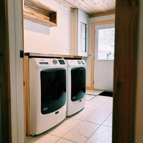Keep your adventures fresh—this laundry room features commercial-style washer and dryer units, ideal for longer stays or active getaways.