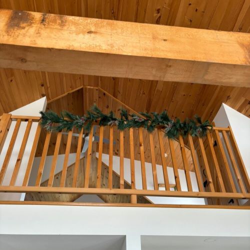 Love how a little greenery transforms the space — soft lights, snowy air outside, and that tucked-away winter feeling inside.