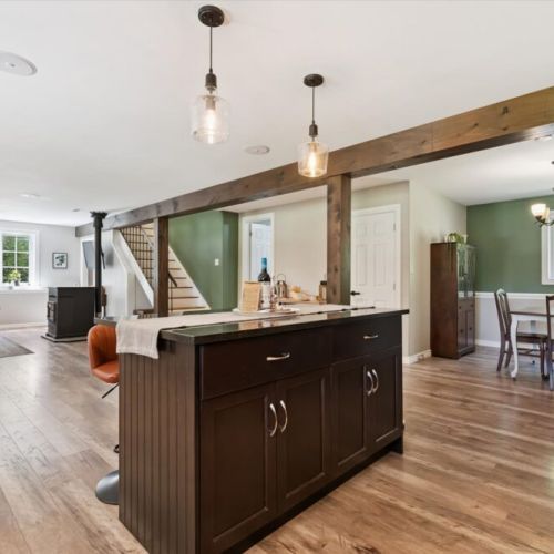 Spacious open layout connecting the kitchen, dining, and living areas — perfect for gathering.