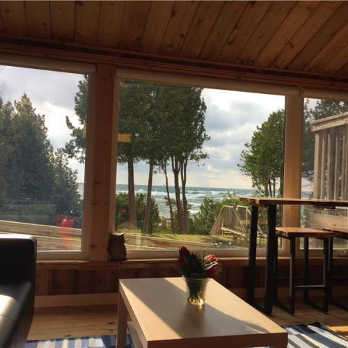 Large windows frame beautiful lake views, bringing the outdoors right into the living space.