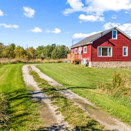 Follow the private country drive to Smith Homestead, surrounded by open fields and peaceful Bruce Peninsula scenery.